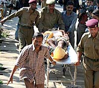 A pilgrim, who was injured in a grenade attack in Pahalgam, being taken to hospital in Srinagar on Saturday.