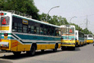 Blueline buses wait in a queue for their fitness test and verification of papers at East Vinod Nagar in the Capital