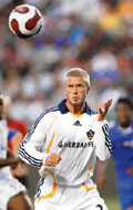 David Beckham heads the ball during his Galaxy debut at a World Series of Football soccer match against Chelsea in Carson, California, on Saturday.