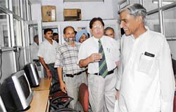 Union Minister of State for Finance Pawan Kumar Bansal inspects the new premises of the Ambedkar Centre at PU after its inauguration in Chandigarh on Monday. Also seen in the picture, V-C R C Sobti, V-C and Prof Manjit Singh, centre coordinator