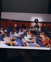 Students watching a programme inside the planetarium 