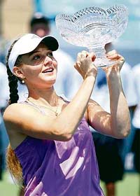 Russias Anna Chakvetadze lifts the trophy after defeating Japans Akiko Morigami 6-1, 6-3 in the final of the Western & Southern Financial Group Womens Open tennis tournament in Cincinnati