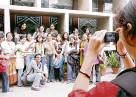 A student clicks a photo of her batchmates outside the Punjab and Haryana High Court building