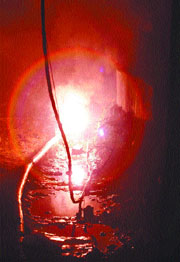 An electric cable caught fire near a dug-up drain on Bahadur Shah Zafar Marg in the Capital on Tuesday.