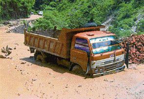 A truck finds its way through the sludge.