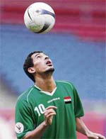 Iraqi forward Younis Mahmoud eyes the ball during a training session at the Bukit Jalil stadium in Kuala Lumpur on Tuesday. Iraq will face South Korea in the semifinals of the Asian Football Cup