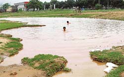Rainwater has turned a pit into a pond at Dasehra ground, Phase VIII, Mohali