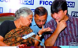 Delhi Chief Minister Sheila Dikshit and power minister Harun Yusuf with BSES chairman Lalit Jalan at a conference on ''Five years of power sector reforms in Delhi: A review'' in the Capital on Wednesday.