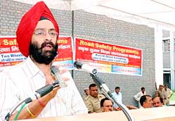 A.S. Chawla, SP, Karnal, addresses students in a road safety programme at Government College, Karnal