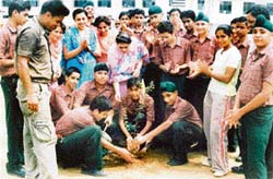 Students of Spring Dale Senior Secondary plant a sapling on the school premises.