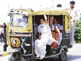 More the merrier: Thats what a Rohtak autorickshaw driver seems to believe, unmindful of the violation of passenger safety norms. 