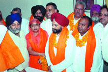 SAD leaders honour those candidates who joined the party after leaving Congress in Jalandhar on Thursday.