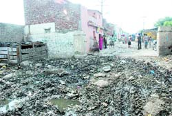 The residents are forced to bear the brunt of a swampy, filthy road at Madrasi Mohalla in Ward number 17 