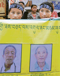 Members of the Tibetan Association of Shimla protest on The Mall in the state capital on Friday, seeking the release of Tibetans under detention in China.