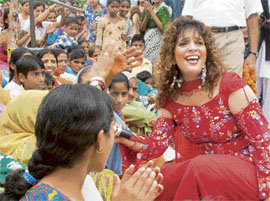 Renowned singer Peenaz Masani comes down from the stage to mingle with the crowd during her performance in a cultural programme held to celebrate the birthday of transport and tourism minister G.S. Bali at Nagrota Bagwan in Kangra district on Friday.