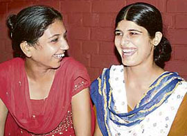 SOS Village inmate Nisha (right), who is to marry on Sunday, shares a light moment with a friend at the village in Rajpura on Friday.