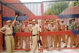 Security staff stand guard at the gate of Burail Jail moments before the judgment in the Beant Singh assassination case at Chandigarh on Friday.