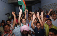 Candidates of Congress file papers amidst loud cheering from supporters.