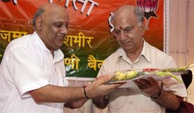 Shanta Kumar, former Himachal Pradesh Chief Minister, being greeted by Ashok Khajuria, state BJP chief, in Jammu