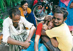 Parents of a labourer in a shocked state after the mishap in which four labourers died in Jalandhar on Saturday