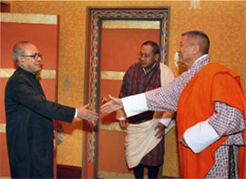 External affairs minister Pranab Mukherjee greets Bhutan Prime Minister Khandu Wangchuck before signing an agreement at Thimpu in Bhutan on Saturday.