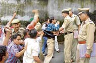 BJP workers protest in front of former minister G.S. Balis residence in Shimla on Sunday.