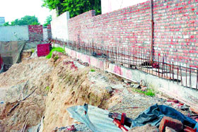 The retention wall constructed to protect the nearby buildings is also alleged to be not up to the mark.