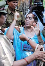 Police killings: Police personnel push AIYF and AISF activists during their demonstration in front of Andhra Bhawan in the Capital on Monday to protest against deaths in recent police firing in Andhra Pradesh. 