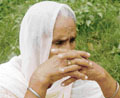 Narinder Kaur, mother of Hawara, sits in distress after coming out of Burail Jail in Chandigarh on Monday.