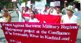Burmese activists of the Kachin National Organisation hold placards and banners during a protest in the Capital on Tuesday. The protest was against the Burmese military regime's hydropower projects to be implemented at the confluence on the Irrawaddy, Mali Hka and Nmai Hka rivers in northern Kachinland. Tribune photo