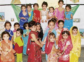 Students of Everest Playway School celebrate Teej in Ludhiana on Monday.