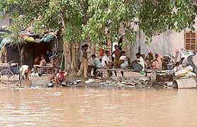 People living on the banks of the Gill canal keep their fingers crossed as the canal overflows.