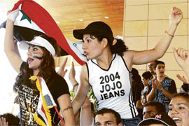 Iraqi fans living in Jordan wait for the arrival of Asia Cup 2007 champions, the Iraqi national football team, in Amman international airport on Wednesday.