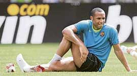 Barcelona's Thierry Henry stretches during a soccer training session at Nou Camp Stadium in Barcelona on Tuesday.