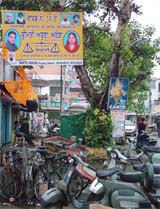 The hoarding of SAD candidate from Ward 55, Aruna Arora, prominently displays the picture of her husband Manoj Arora in Jalandhar on Thursday.