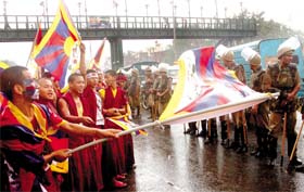 Tibetan activists wave flags and shout slogans as they attempt to leave Majnu Ka Tilla on Saturday to attend the flagging-off of a marathon race and a football match between a Tibetan national team and a Delhi XI organised by The Friends of Tibet