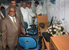 Chief Justice of India K.G Balakrishnan and Chief Minister Bhupinder Singh Hooda inside the countrys first mobile court after the inaugural function at Punahana in Mewat district 