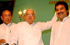 Former Chief Minister Bhajan Lal blesses his son Kuldeep Bishoni at the Press Club, Sector 27, Chandigarh, on Saturday. Gohana MLA Dharampal Malik is also seen in the picture
