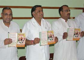 BJP minister Manoranjan Kalia (C) releases manifesto in Jalandhar