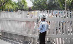Securitymen at Panjab University close the gates in an attempt to catch “miscreants” on Monday.