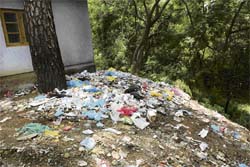 A pile of hospital waste lying in the open near the Zonal Hospital, Dharamsala. 