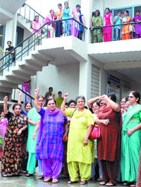 Staff of PCMSD College of Women protest in Jalandhar on Monday. 