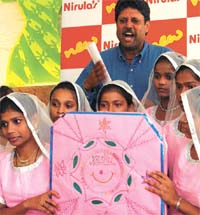 Former Team India cricket captain and chairperson of Khushi NGO Kapil Dev with children during a function in the Capital.