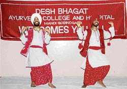 Students of Desh Bhagat Ayurvedic College perform bhangra on the closing day of International Breast Feeding Week in Mandi Gobindgarh on Tuesday.