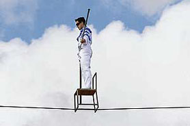 Circus acrobat Henri Ayala of Columbia, stands on a chair on a high wire above a circus tent during an attempt to set a Guiness World record by balancing on a chair on a high wire out of doors, York, northern England, on Tuesday.