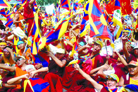 Tibetan activists and monks shout anti-China slogans during a march to the Parliament House in the Capital on Wednesday