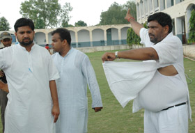 Congress municipal candidate Kabir Dass shows his torn clothes after he was allegedly attacked by SAD-BJP workers during the Municipal Corporation elections in Patiala 