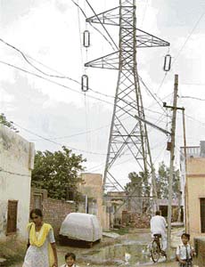 High-tension wires pass through a residential colony in Hisar