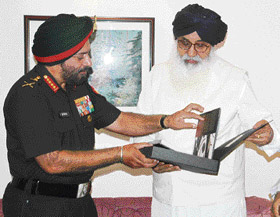 Chief of Army staff Gen J.J. Singh presents an Army album to Chief Minister Parkash Singh Badal at Punjab Bhawn in Chandigarh 