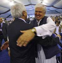 Pakistani interior minister Aftab Ahmad Khan Sherpao (right) greets Afghan foreign affairs minister Dadfar Rangin Spanta during a peace 'jirga' in Kabul on Thursday.